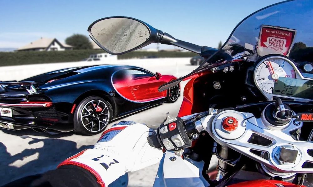 Bugatti Chiron races a BMW S1000RR Superbike on a highway