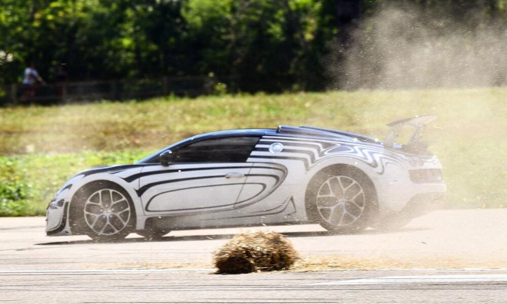 Straw bale disintegrates as a Bugatti Veyron Crashes into it